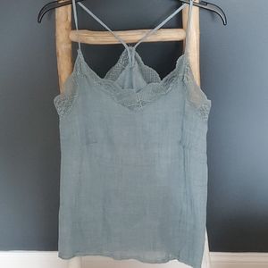 This is a light blue lace-trim camisole top. Small